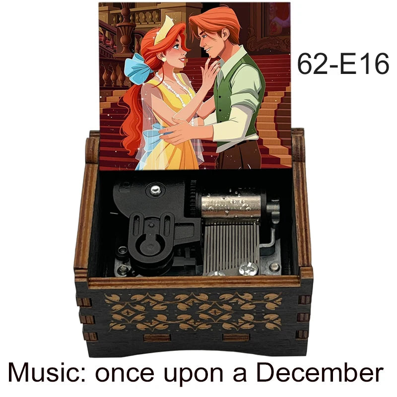A hand-cranked wooden music box featuring an illustration of two characters, labeled 62-E16.