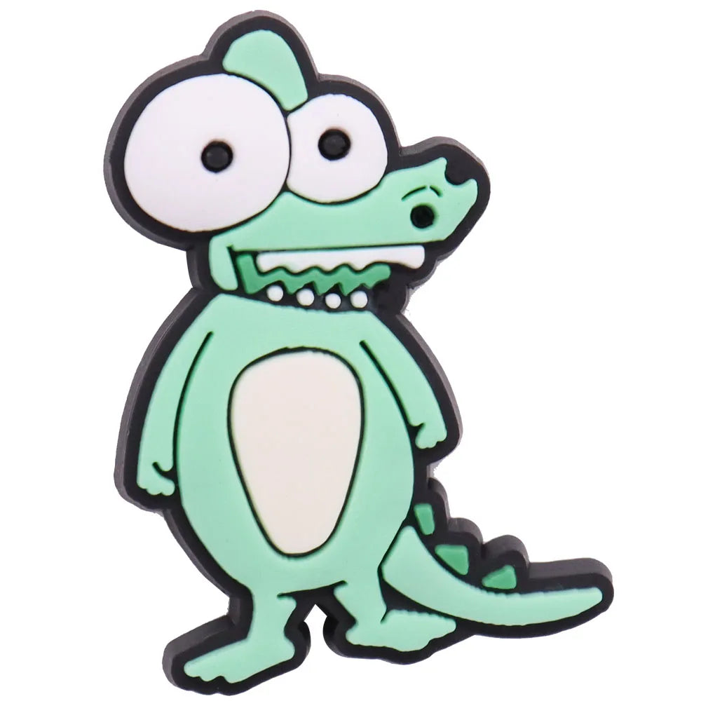 A green cartoon dinosaur charm with large eyes and teeth.