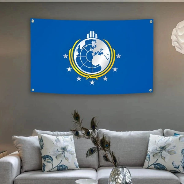 A blue flag featuring a white globe design with yellow lines and stars, mounted on a wall.