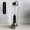 Botella de agua de vidrio transparente con inserto de columna de cristal de obsidiana y tapa de plata.
