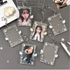 A collection of clear acrylic photo card holders with attached charms and keychains featuring a female idol.