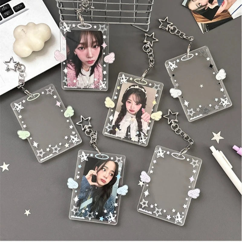 A collection of clear acrylic photo card holders with attached charms and keychains featuring a female idol.