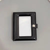 A black mini photo card binder with a clear window and a silver clasp.