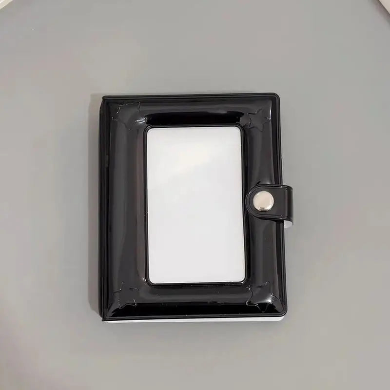A black mini photo card binder with a clear window and a silver clasp.