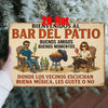 A rustic wooden sign welcomes guests to Bar del Patio featuring illustrations of people enjoying drinks and music.