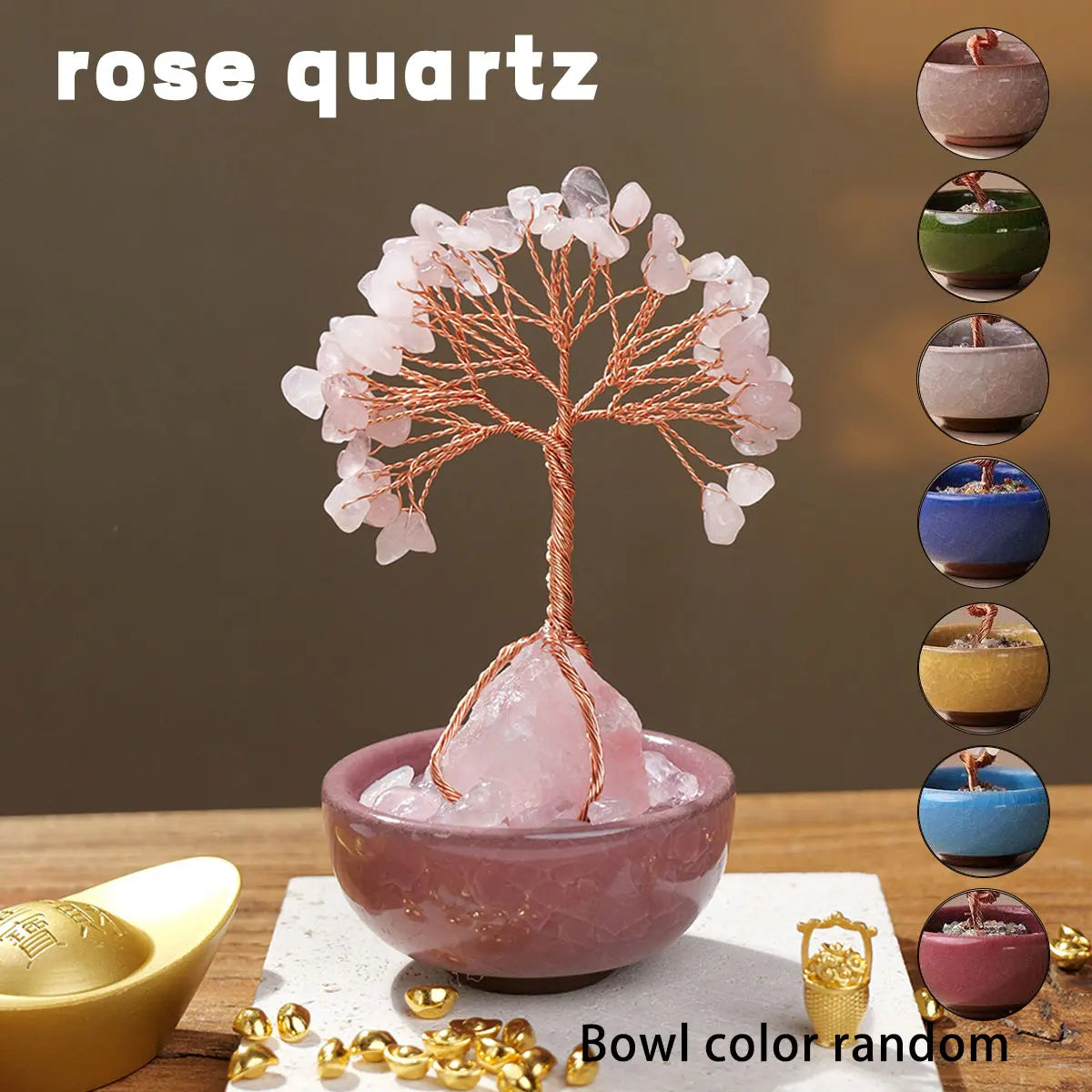 A natural crystal money tree with a rose quartz base displayed on a wooden surface.
