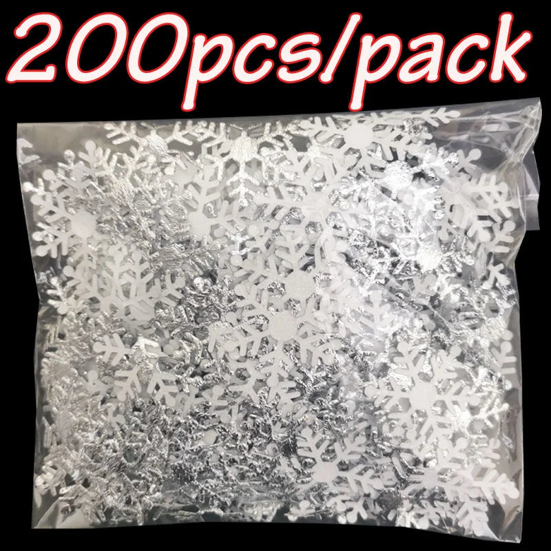 A clear bag filled with silver frosted snowflake confetti for holiday decorations.