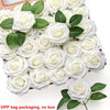 A bouquet of white foam rose flowers with green leaves arranged in a box for DIY projects.