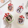 A set of cartoon strawberry bag keychain card holders featuring women's faces and pink, green, and yellow floral designs.