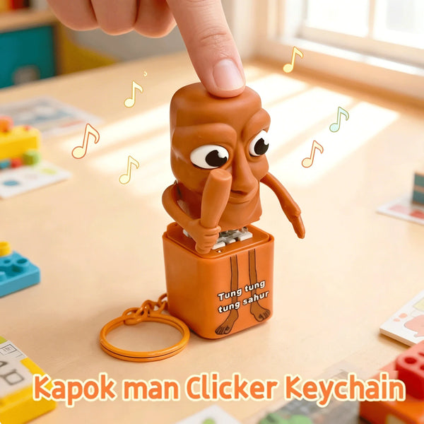 An orange wooden stick man figure attached to a keychain, showing a glow effect.