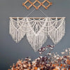 Handwoven boho macrame wall hanging tapestry with white fringe and diamond patterns