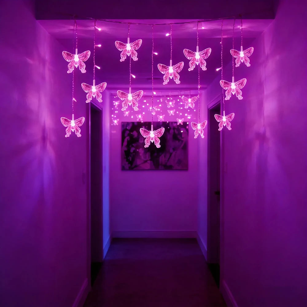 String lights shaped like pink and white butterflies hang in a purple hallway.