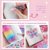 Hands demonstrate using glue and tweezers to create a pattern on a surface with rhinestones.
