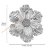 A grayscale image of a layered resin floral wall decor flower with delicate petals.