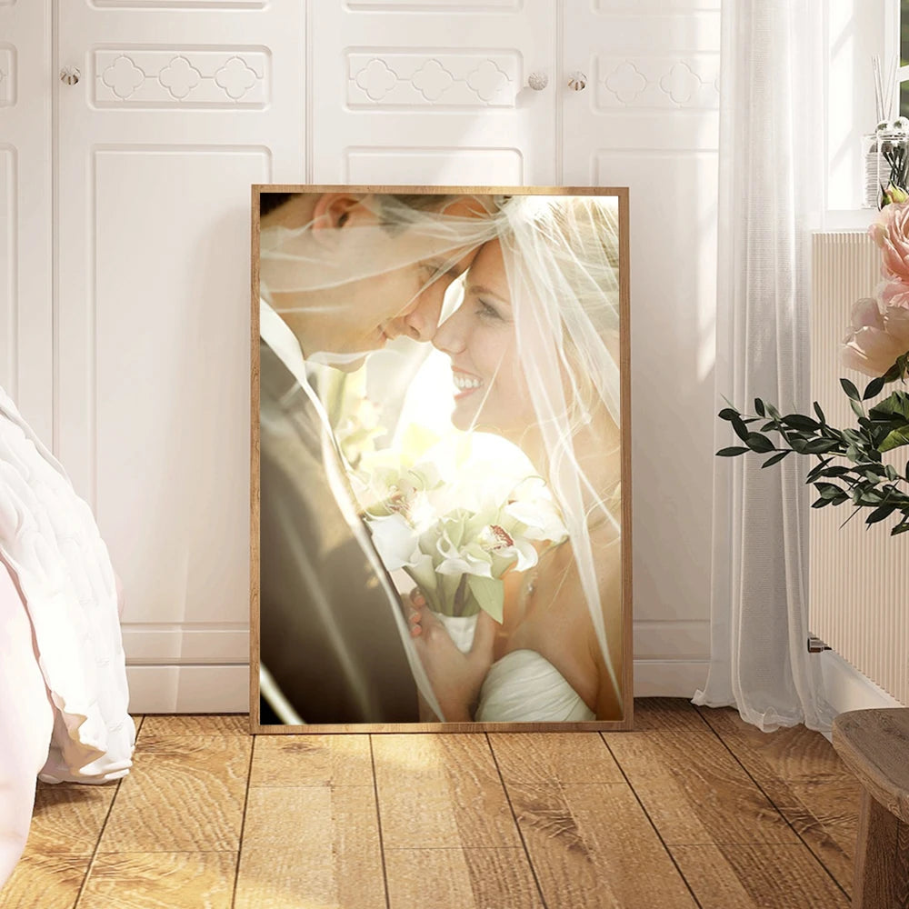 A framed photograph of a bride and groom looking lovingly into each other's eyes, captured in soft natural light.