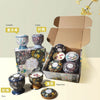 A gift set of soy wax aromatherapy candles in various floral scents including lavender, lemon, and rose, displayed in cardboa