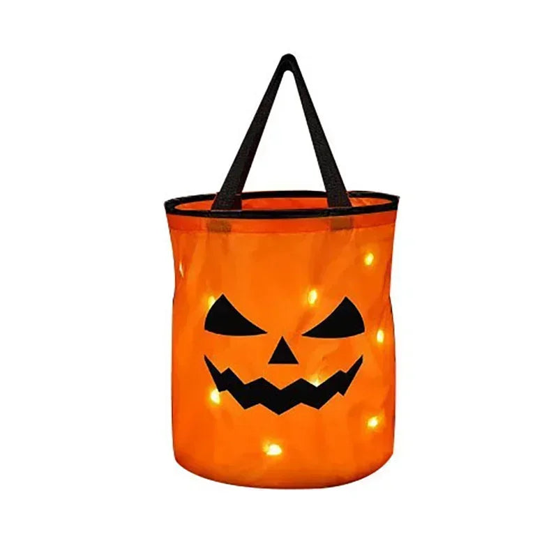 An orange Halloween pumpkin tote bag with a black handle and LED light-up features.