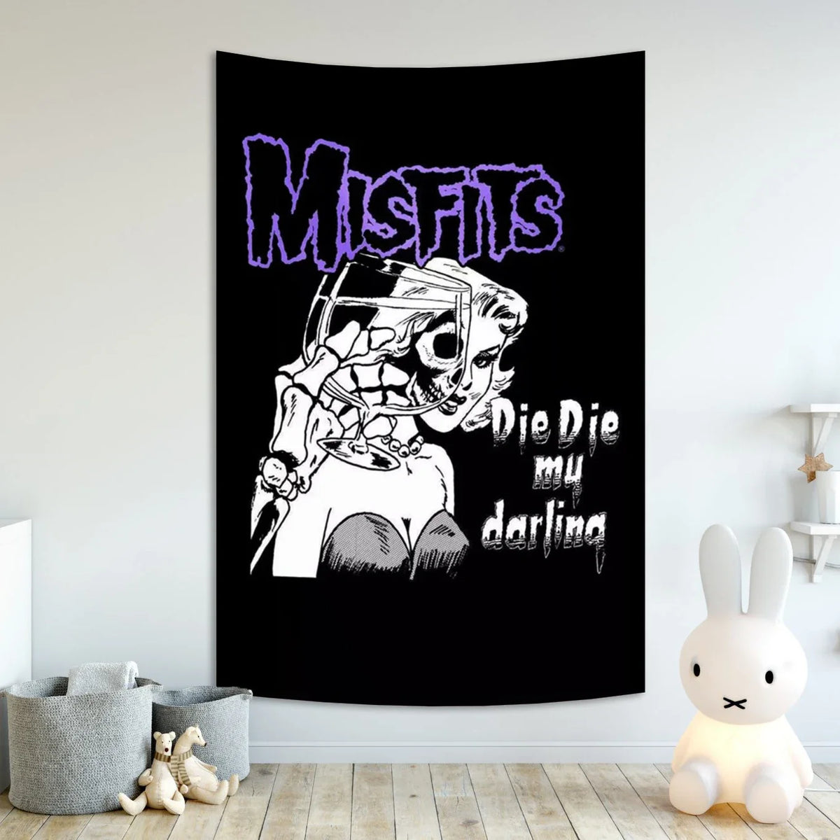Black poster featuring the text MISFITS and a stylized drawing of a woman with sharp features.