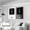 A custom song lyric canvas poster displayed on a white wall next to a white sofa.
