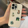 A light beige phone case decorated with vintage forest witch stickers featuring lanterns and architecture.