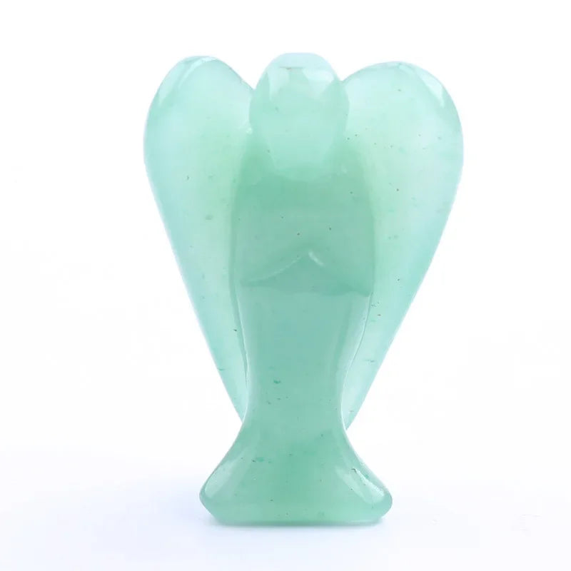 Hand-carved seafoam green crystal figurine shaped like an angel.