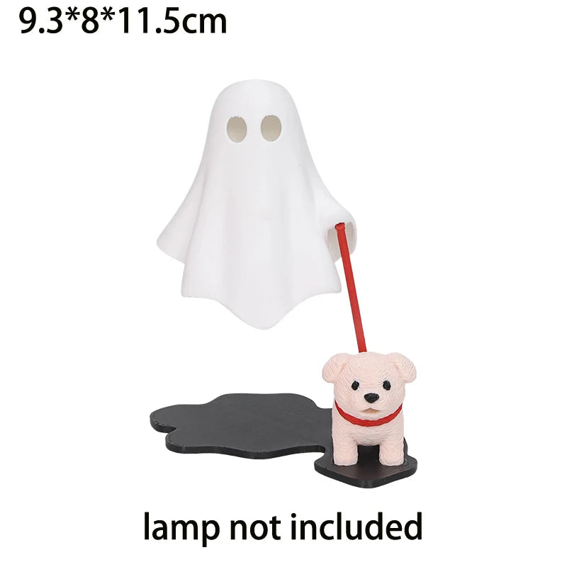 White ghost figurine with a red stick and a small pink dog figure on a black base