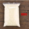 A clear plastic bag filled with white natural soy wax flakes for DIY candle making