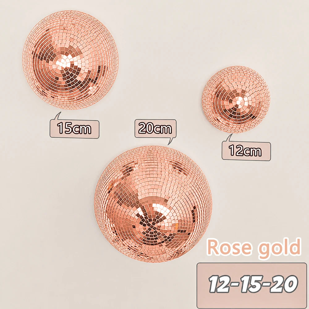 Rose gold disco balls of varying sizes 12 to 20 cm displayed against a light background