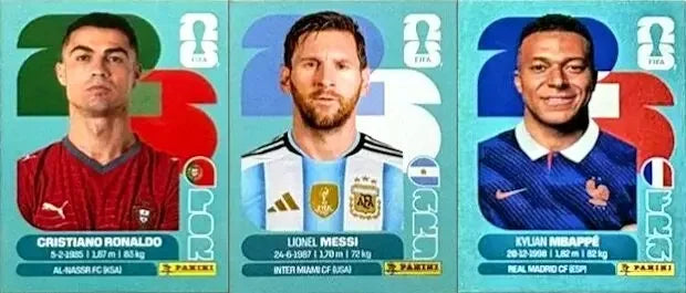 Three football players Cristiano Ronaldo, Lionel Messi, and Kylian Mbappé on Panini 2026 FIFA World Cup sticker boxes.