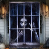 A dark, spooky window banner featuring a ghostly face peering through a grid of panes.