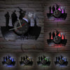 A display of vintage vinyl record wall clocks mounted on a gray brick wall.