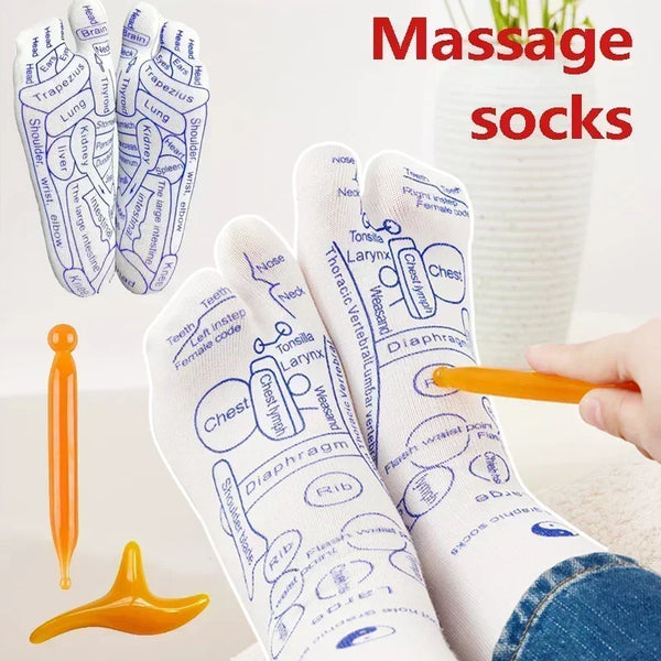 White acupressure foot massage socks and an orange acupressure tool are shown on a surface.