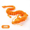 An orange silk dragon ornament made of detailed resin for terrariums and decor.
