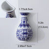Blue and white ceramic flower vase with intricate floral patterns shown from the side.