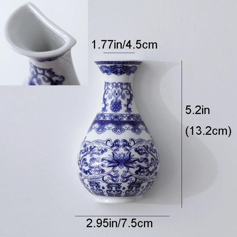 Blue and white ceramic flower vase with intricate floral patterns shown from the side.