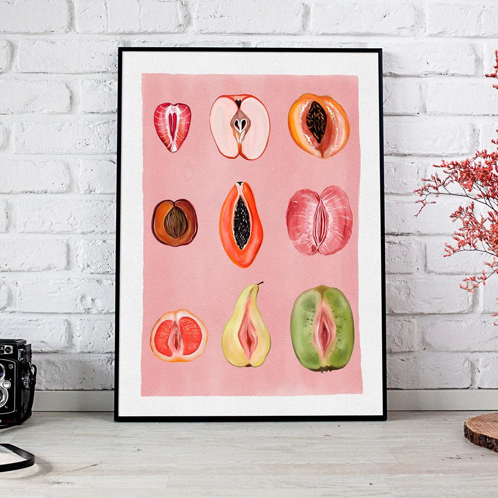 A framed canvas print featuring watercolor illustrations of various fruits like apples, pears, and citrus slices on pink pape