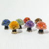 A collection of natural crystal mushroom trees displaying various colors including blue, yellow, green, purple, and orange.