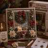 A box of Christmas 3D fabric poke art kit featuring a winter forest scene with evergreen branches and red berries.