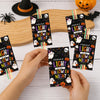 A hand holds a Halloween glow stick holder card featuring a ghost and pumpkin design.