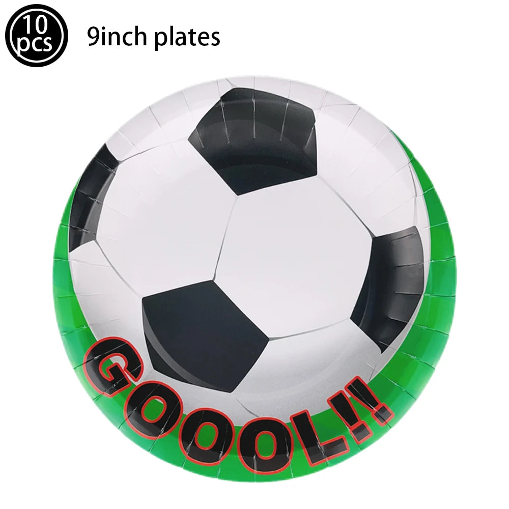 A soccer ball cake topper featuring a white and black patterned ball with red text that reads GOOOL!