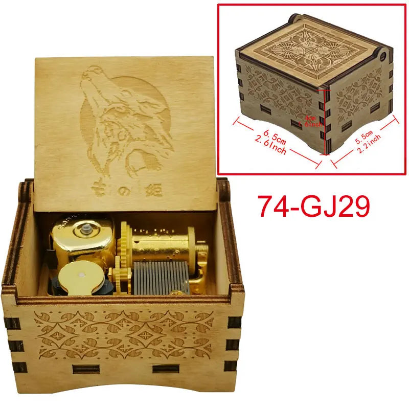 A wooden music box featuring a gold-colored mechanism and decorative patterns, with an engraved design on the lid.