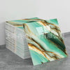 Rolls of faux marble 3D self-adhesive wall tiles featuring green and gold veining