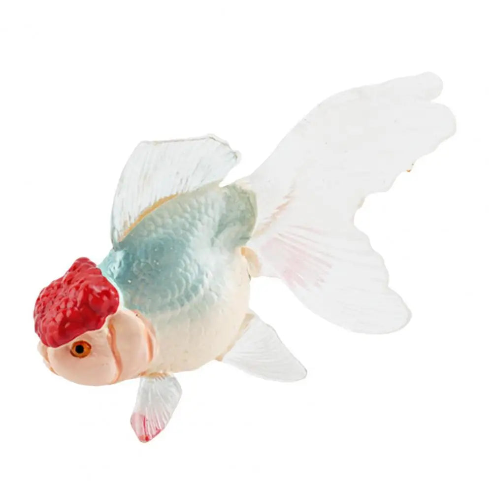 A realistic goldfish aquarium decor figurine with a reddish-orange body and translucent white fins.