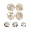 A set of four circular wooden wall art pieces with concentric line patterns.