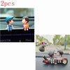 A set of two cute couple balloon car ornaments featuring a boy and a girl.