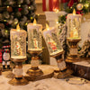 A festive snowflake candle wind lamp displayed on a golden candlestick with sparkling glass and festive greenery.