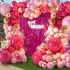 A pink and gold balloon garland arch kit featuring numerous balloons for celebrations.