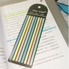 A set of sticky strips with various colored stripes used as book or office index tabs.
