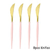 Eight disposable knives with gold blades and pink handles