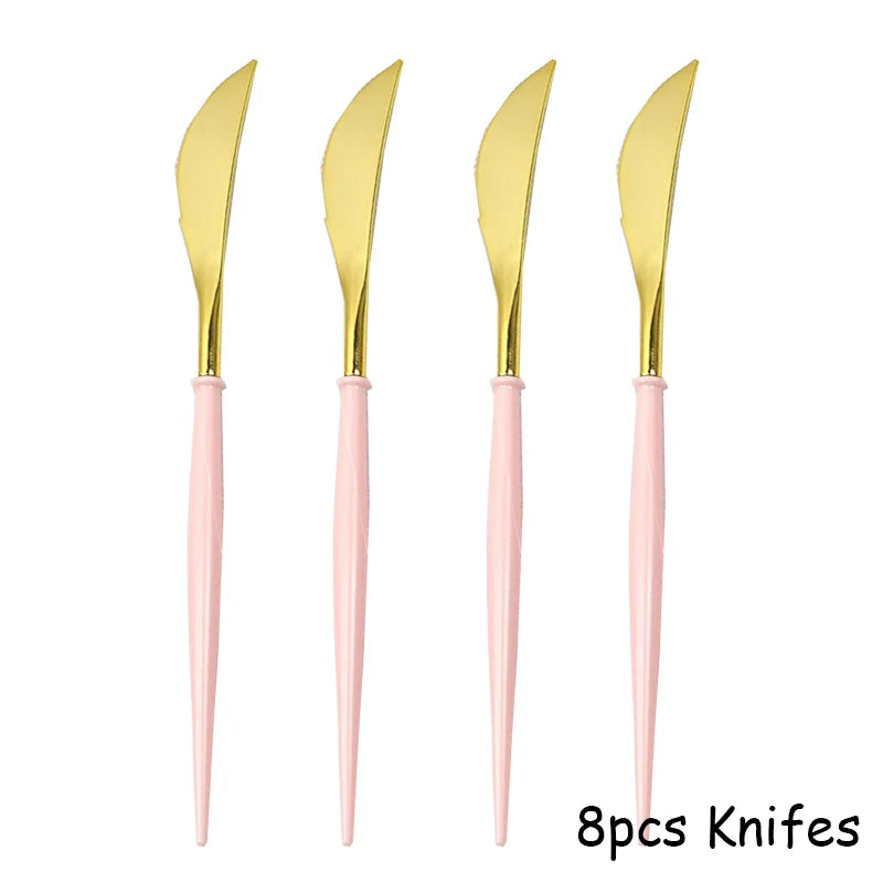 Eight disposable knives with gold blades and pink handles
